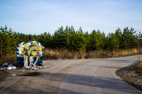 Workers managing construction waste disposal practices in Highgate
