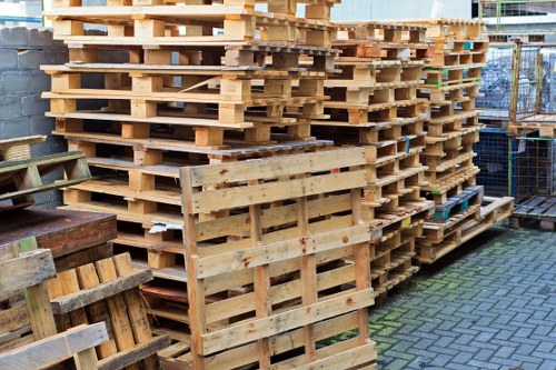Worker wearing PPE preparing skip for collection
